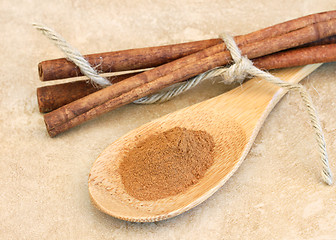 Image showing Ground cinnamon on wooden spoon