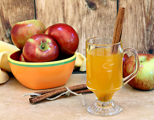 Image showing Apple cider with cinnamon sticks