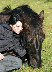 Image showing horse laid down and riding girl