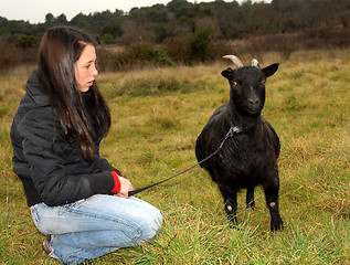 Image showing teen and goat