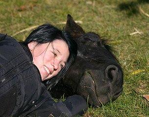 Image showing horse laid down and riding girl