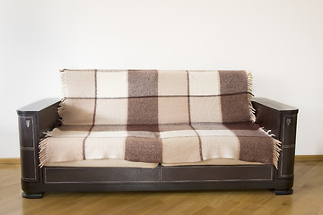 Image showing classic sofa on the wooden floor