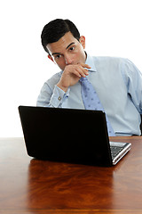 Image showing Man sitting at desk thinking pondering