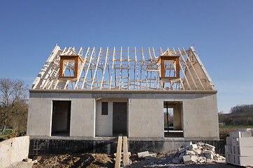 Image showing house under construction with the roof structure of wood