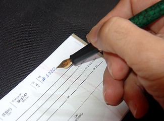 Image showing Filling a check
