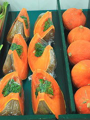 Image showing fresh and colorful pumpkins on a market stall