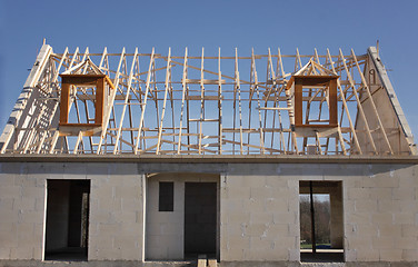 Image showing house under construction with the roof structure of wood