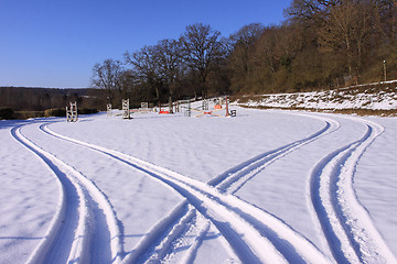 Image showing tire tracks in the snow in winter