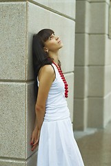 Image showing Girl with red beads