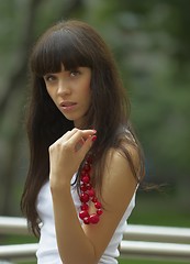 Image showing Girl with red beads