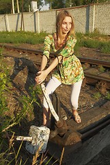 Image showing Young woman on railway