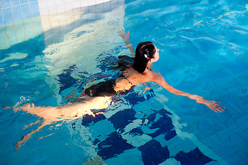 Image showing Attractive girl in swimming pool