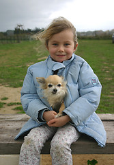 Image showing child and chihuahua