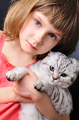 Image showing child with her pet cat