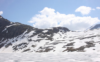 Image showing frozen lake and snowy mountains in norway