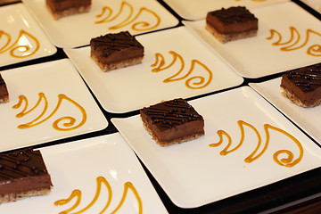 Image showing preparation of dessert plates for a chocolate cake louis XV