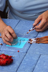 Image showing Process of lace-making with bobbins 