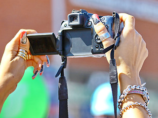 Image showing  Camera in women's hands