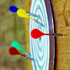 Image showing  Colorful darts on dartboard