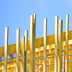 Image showing  Wooden house frame against blue sky