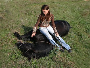 Image showing horse laid down and riding girl