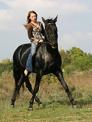 Image showing young woman and horse