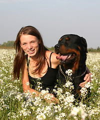 Image showing teenager and rottweiler