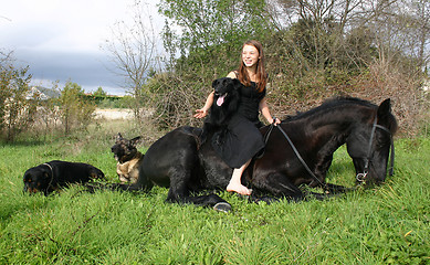 Image showing horse laid down and riding girl