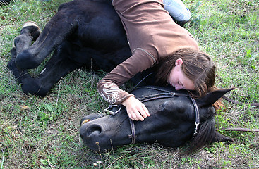 Image showing horse laid down and riding girl