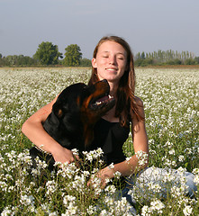 Image showing teenager and rottweiler