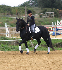 Image showing horse and woman in dressage