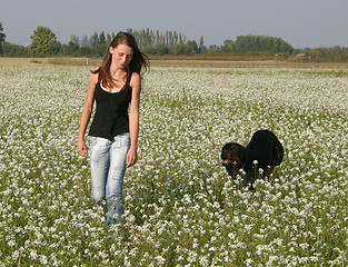 Image showing teenager and rottweiler