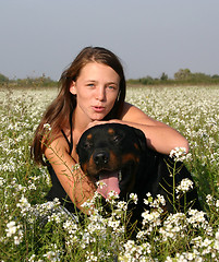 Image showing teenager and rottweiler