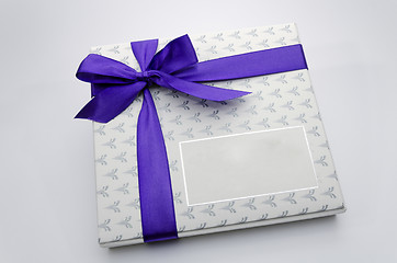 Image showing Printed over a purple ribbon gift box