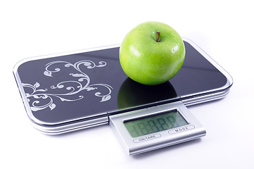 Image showing Apple on the scales