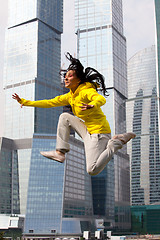 Image showing girl in a tracksuit jumping