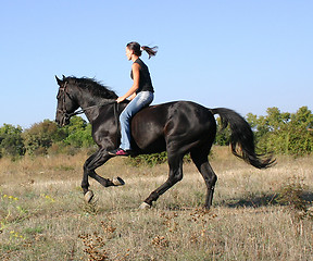 Image showing young woman and horse