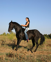 Image showing young woman and horse