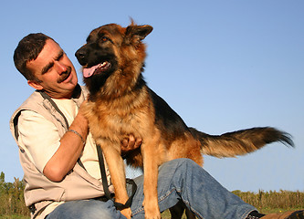 Image showing german shepherd and man