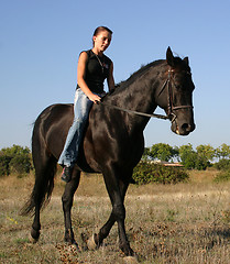 Image showing young woman and horse