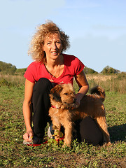 Image showing Pyrenean sheepdog and woman