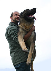 Image showing german shepherd and man