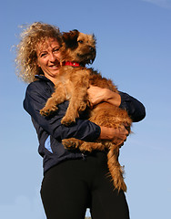 Image showing Pyrenean sheepdog and woman