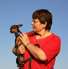 Image showing miniature pinscher and woman 