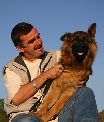 Image showing german shepherd and man