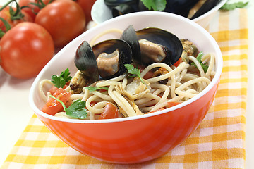 Image showing Spaghetti with mussels and parsley