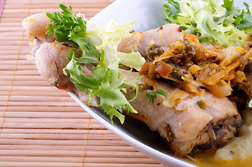 Image showing Roasted chicken legs with mashed potatoes, vegetables saute and greens