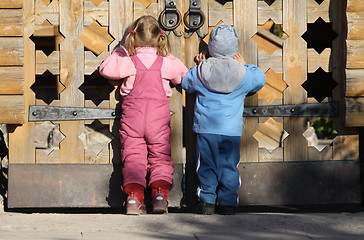 Image showing Children near the wooden gates