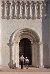 Image showing The woman and the girl at temple doors