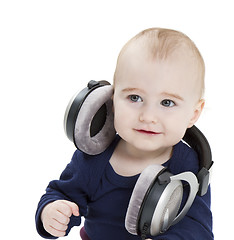 Image showing young child with ear-phones listening to music